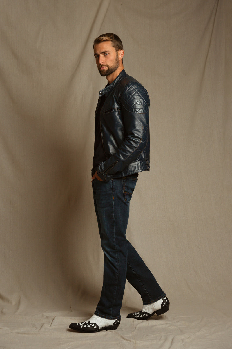 Model styling Black Butte iguana cowboy boots with bold urban outfit